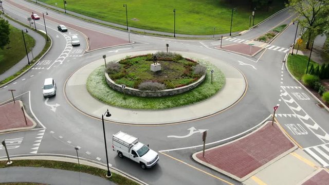 Drone shot slow dolly forward and tilt down, aerial view of traffic circle roundabout in Hershey Pennsylvania