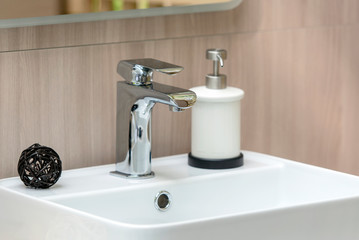 Interior of modern Bathroom with white Sink and Faucet, close-up Sink