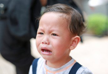 Close up Asian little boy crying with tearful on her face.