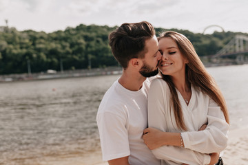 Obraz premium Couple in love, enjoying the summer time near the lake. Close up of smiling couple