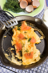 omelette with scotch smoked salmon in a cast iron pan