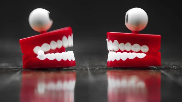 two toy teeth chatting macro  footage 