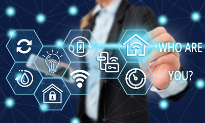 Text sign showing Who Are Youquestion. Business photo showcasing someone asking your demonstratingal background or history Female human wear formal work suit presenting presentation use smart device