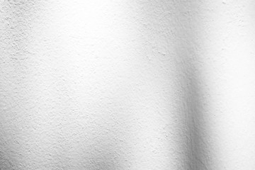 White Stucco Wall Texture Background with Light Leak from the Top.