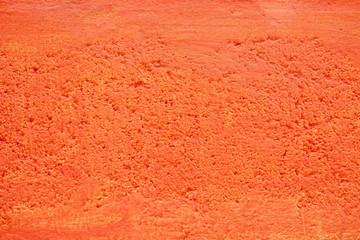 Orange Painting on Concrete Wall Texture Background.