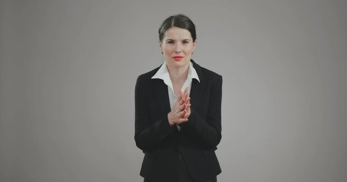 businesswoman came up with plan and rubs her palms