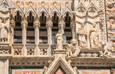 Architectural fragment with sculptures of  Siena Cathedral in honor of  Ascension of  Blessed Virgin Mary