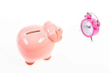 It is time to pay. Piggy bank pink pig and little alarm clock. Financial crisis. Banking account. Bankruptcy and debt. Pay for debt. Bank collector service. Credit debt. Economics and finance