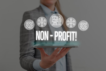 Writing note showing NonProfit. Business concept for not making or conducted primarily to make...