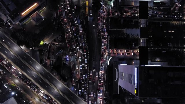 Jakarta, Indonesia rush hour night traffic. Aerial view of downtown Jakarta streets crowded with motorcycles, cars, and buses (Part 7)