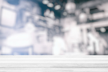 White Wood Table with Blurred White Cafe Room Background, Suitable for Product Display and Business Concept.
