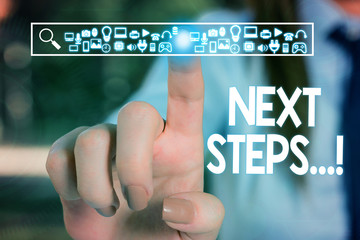 Text sign showing Next Steps. Business photo text something you do after you have finished doing first one Woman wear formal work suit presenting presentation using smart device