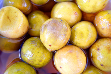 Pickled lemons immersed in water