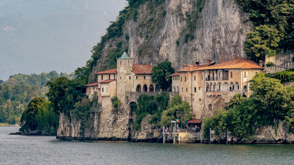 The beautiful Hermitage of Santa Caterina del Sasso overlooking the water of Lake Maggiore, Lombardy, Italy