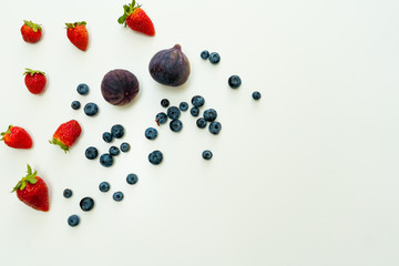 Summer flat lat background with copy space on right and different berries.