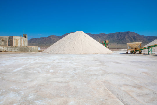 large pile of sea salt in exterior of saltworks in Las Salinas of Cabo de Gata, in Almadraba de Monteleva (Almeria, Andalusia, Spain, Europe)
