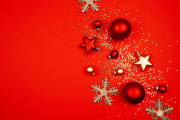 Christmas decorations on a red background. Sequins, snowflakes, New Year concept.