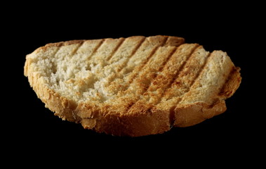 Toast slice isolated on black background
