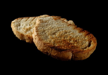 Toast slices isolated on black background