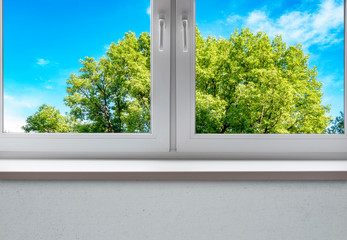 Modern Window with Frame and Sill, View to the Park, green Trees. Summer, Spring Window Background