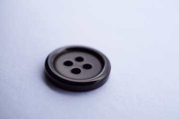 black button on white background
