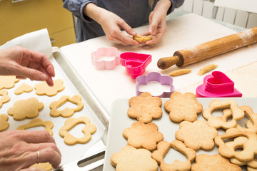 little girl makes a cookie in the kitchen