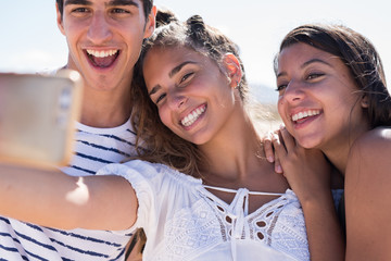 Three young people looking at the camera