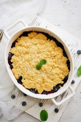Homemade Blueberry cornmeal Cobbler baked in a Ramekin