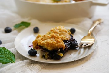 Homemade Blueberry cornmeal Cobbler baked in a Ramekin