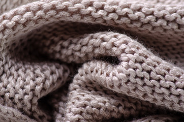 Beige warm knited material fabric sweater texture blur background