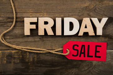 Friday word and label on wooden background