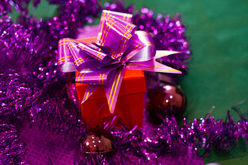  Red box with gifts on the background of Christmas decorations. background for design. Happy New Year 2020..
