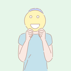 Hand drawn style vector illustration of a man holding an smiling emoji sign in front of his face. Concept of good emotion, cheerful mood, positive facial expression.