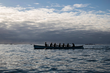 A group of rowers in a pilot gig on the Atlantic Ocean  © zichrini