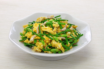 stir fried flowering garlic chives with eggs, chinese cuisine