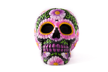 Typical Mexican skull painted isolated on white background. Dia de los muertos.