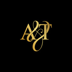 Initial letter A & T AT luxury art vector mark logo, gold color on black background.