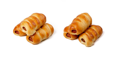 Group of freshly baked sausages in the dough isolated on white background