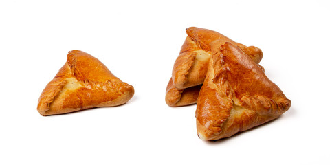 Group of freshly baked Kurniks isolated on white background. Traditional slavic chiken pies © PixPaf