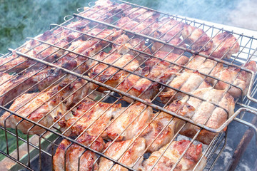 Meat pork beef on the grill cooking process barbecue. traditional outdoor recreation.