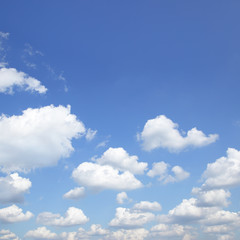 Naklejka na ściany i meble Blue sky with white heap clouds - background