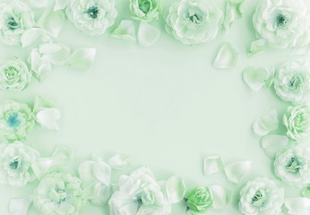 Flowers composition background. beautiful roses on neo mint color    background.Top view.Copy space