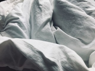 White linen folded bed sheets 