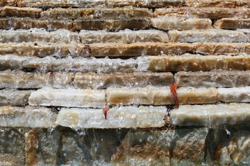 Water cascades and falls over carefully placed stones in La Quinta.