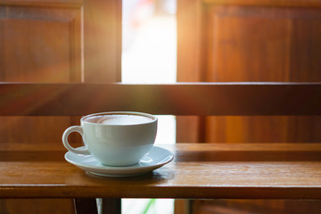 Hot Coffee Late Art on Wood Table in Coffee Shop