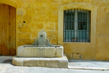 stone fountain in mediterranean village 