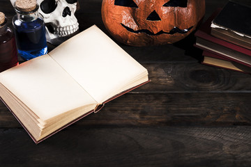 Halloween attributes on wooden desk