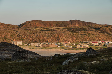 Fototapeta na wymiar Summer landscape of the green polar tundra in the vicinity Teriberka