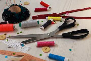 sewing set of threads, needles and scissors