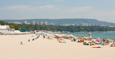 VARNA, BULGARIA - AUGUST 14, 2015: people rest on city beach.